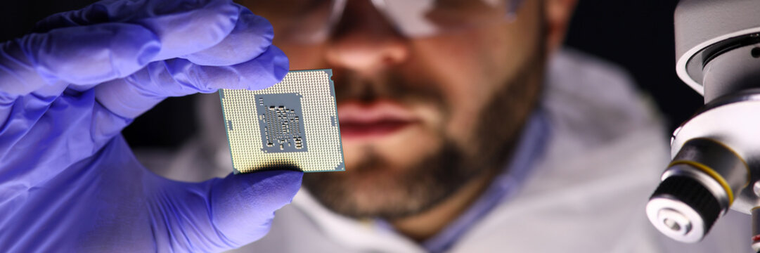 Worker making diagnostics of chip
