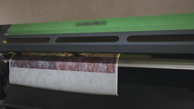 Industrial printer making new wallpaper sample. Modern wallpaper factory. Wallpaper production. One of step creation new wallpaper. Closeup