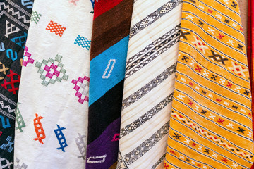 Plenty of famous traditional Berber carpets on sale, in Morocco