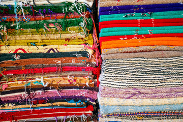 Plenty of famous traditional Berber carpets on sale, in Morocco