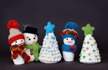 Handmade Waldorf toys, Christmas tree, snowman and lovely dwarfs winter holiday concept on black background