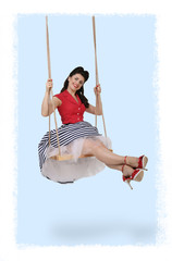 vertical pin-up photo of a brunette girl on a swing
