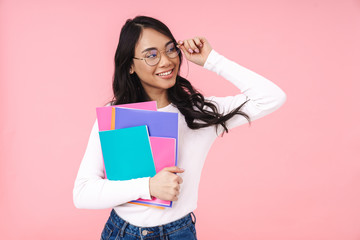 Image of young asian student girl wearing eyeglasses holding folders