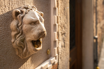A doorbell in shape of a lion head in Venice