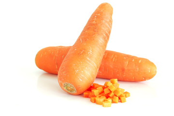 Fresh carrot and cut pieces isolated on white background