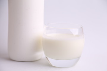 liquid yogurt bottle in color background