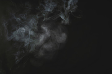 Smoke in the dark. fog on the black background
