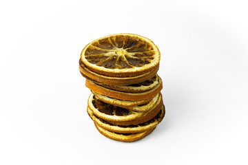 Dried orange slices in heaps. Isolates on a white background
