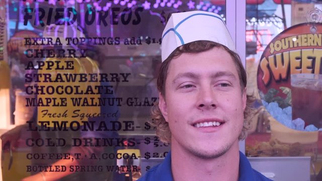 Fried Oreo Food Stand And Concession, Worker, Young Man Standing In Front Of Food