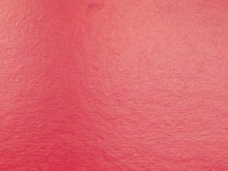 Fototapeta premium Red paper texture, background with space for text or image.