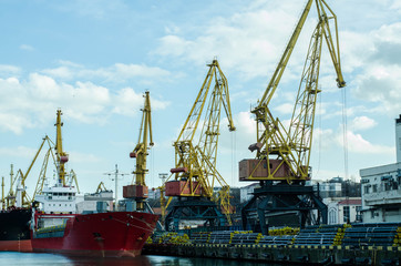 Fototapeta premium Sea port. Ships are in the port. Port cranes.