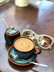 cup of coffee and grinder