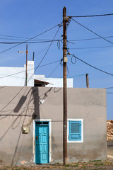 House behind electricity pole in Cape Verde