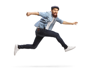 Bearded man in casual clothes jumping