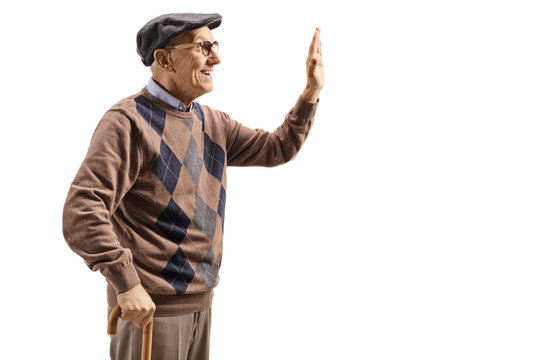 Profile Shot Of An Elderly Man Gesturing High-five