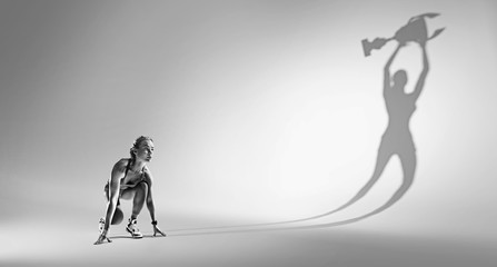 Sports background. Runner on the start. Black and white image isolated on white with long shadow of the winner.  - obrazy, fototapety, plakaty