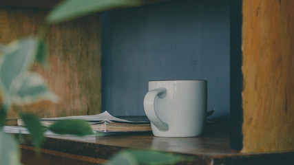 cup of coffee on wooden table