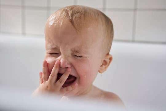 Baby crying in bath