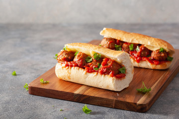 meatball sub sandwich with cheese and marinara tomato sauce. american italian fast food