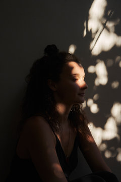 Women sat in dappled light