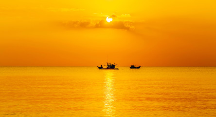 Fototapeta premium Colorful ocean gold sunrise Fishing Boat
