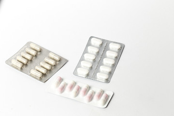 Assorted colorful pills and capsules in a Blister packaging