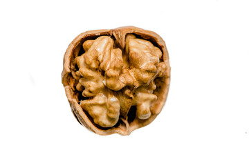 Isolated walnut with a cracked nutshell