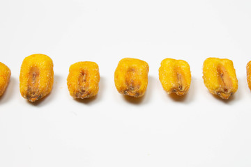 Fototapeta na wymiar Roasted corn nuts on white background