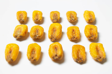 Roasted corn nuts on white background
