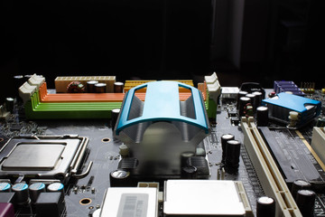 Computer motherboard close up on black background