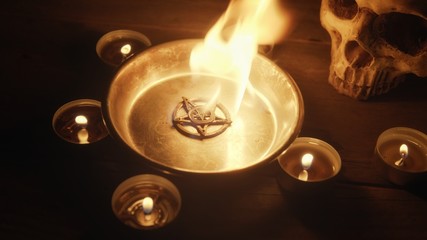 Burning pentacle on altar closeup photo