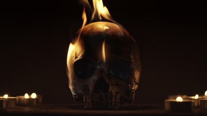 Burning human skull closeup photo