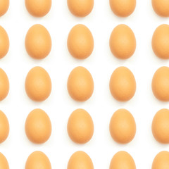 Seamless texture of chicken eggs on a white background. Repeating eggs pattern.