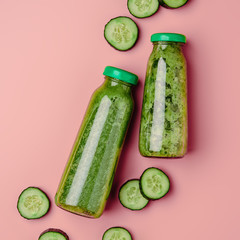 Cucumber vegan smoothie, nutrient hydrating green juice, detox food, weight loss concept, pink...