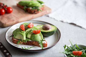 healthy breakfast with avocado and Delicious wholewheat toast. sliced avocado on toast bread with spices. Mexican cuisine
