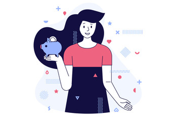 Young female student holds a piggy bank