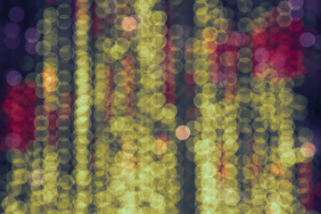 Defocused photography of city lights in night. Yellow bubbles backgrounds.