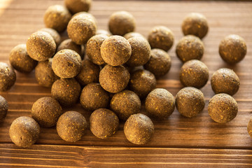 Carp baits on a wooden background.