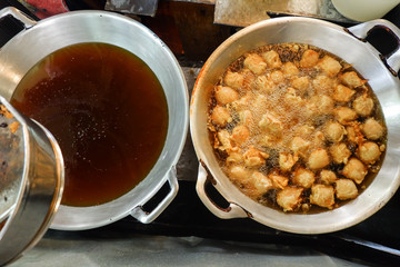  fried tofu in a frying pan with boiling oil