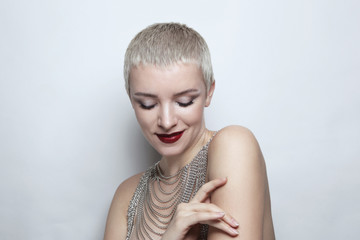 Beautiful woman with short haircut and wine red lipstick