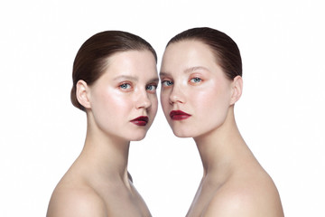 Portrait of two young beautiful girls with clean eye makeup