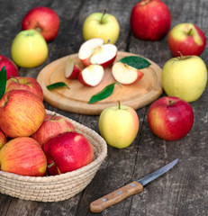 Ripe red and yellow  apples on table close up