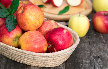 Ripe red and yellow apples on table close up