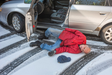 Senior man slipped on ice coming out of his car