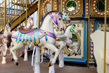 Fototapeta na wymiar Merry-go-round with horses