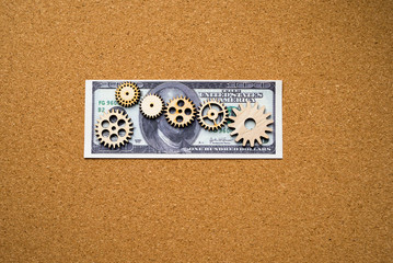 Gears, American dollars. the concept of business financial investment.