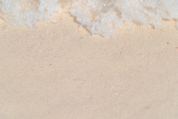 Top view of sea water surface wave ripple on the clean white sand from the top