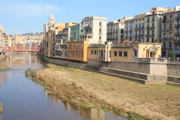 The amazing colorful houses along the river Onyar and the Cathedral of Saint Mary in the gorgeous city of Girona, Catalonia, Spain.