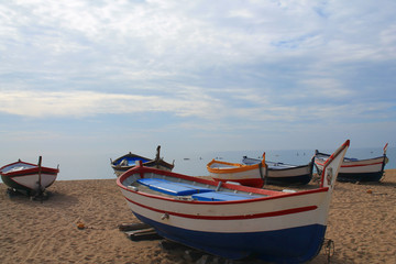 Traditionals wooden boats in Callela beach, a seaside city on the Costa del Maresme, in the northeast of Barcelona, in Catalonia, Spain
