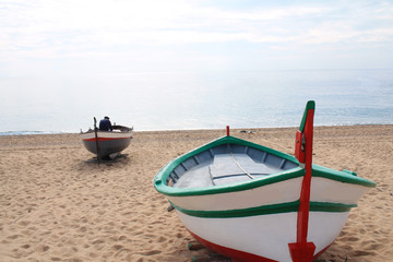 Traditionals wooden boats in Callela beach, a seaside city on the Costa del Maresme, in the northeast of Barcelona, in Catalonia, Spain